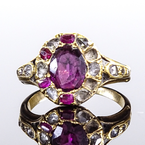 538 - A 19th century unmarked gold ruby and rose-cut diamond cluster ring, 11.6mm, size J, 31.g (2 rubies ... 