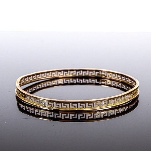 539 - A 9ct gold Greek Key design slave bangle, band width 6.3mm, internal diameter 78mm, 6.8g