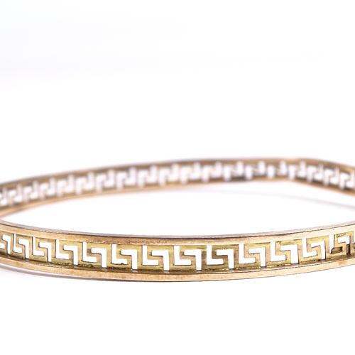 539 - A 9ct gold Greek Key design slave bangle, band width 6.3mm, internal diameter 78mm, 6.8g