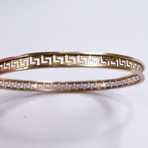 539 - A 9ct gold Greek Key design slave bangle, band width 6.3mm, internal diameter 78mm, 6.8g