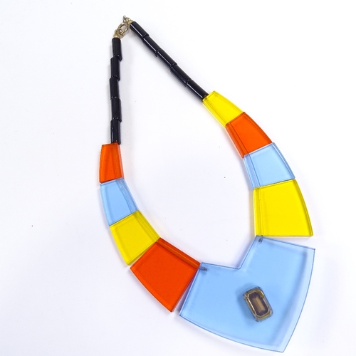 540 - A Vintage multi-colour transparent perspex panel costume necklace, inset paste stone in central pane... 