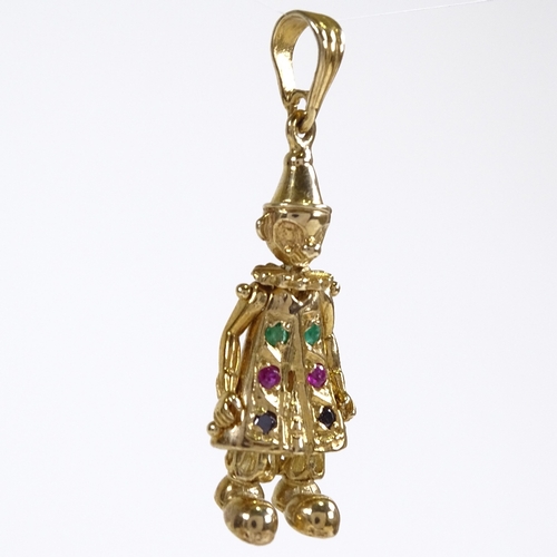 541 - A novelty 9ct gold gem set articulated figural clown pendant, set with emeralds, rubies and sapphire... 