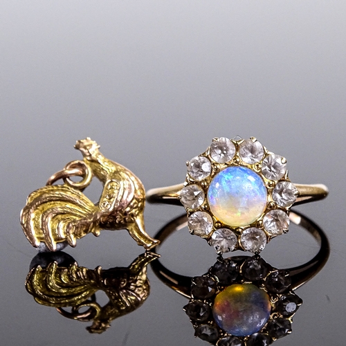 542 - An unmarked gold cabochon opal and white sapphire cluster dress ring, setting height 11.7mm, size L,... 