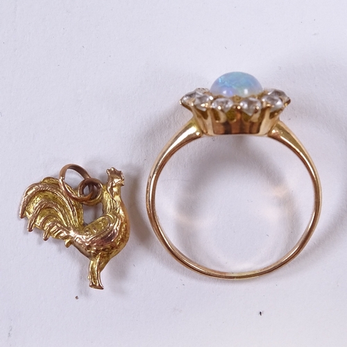 542 - An unmarked gold cabochon opal and white sapphire cluster dress ring, setting height 11.7mm, size L,... 