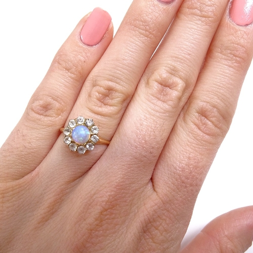 542 - An unmarked gold cabochon opal and white sapphire cluster dress ring, setting height 11.7mm, size L,... 