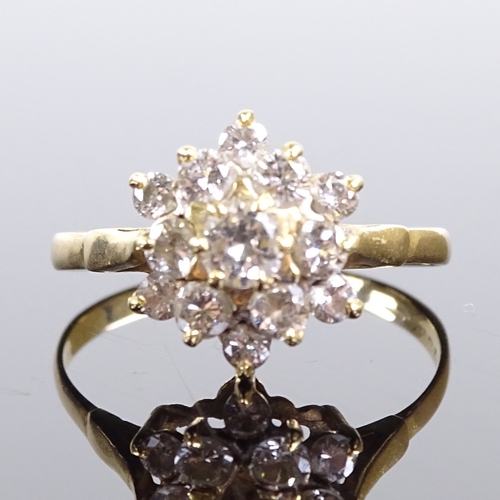 545 - A late 20th century 18ct gold diamond cluster snowflake dress ring, total diamond content approx 1ct... 