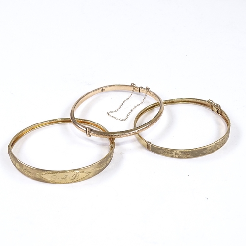 553 - 3 9ct gold hinged bangles, internal length 58mm, internal height 50mm, 17.2g total (3)