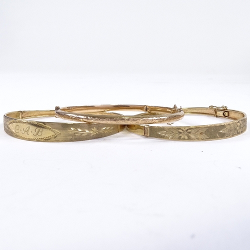 553 - 3 9ct gold hinged bangles, internal length 58mm, internal height 50mm, 17.2g total (3)