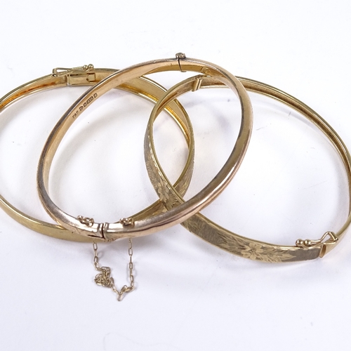 553 - 3 9ct gold hinged bangles, internal length 58mm, internal height 50mm, 17.2g total (3)