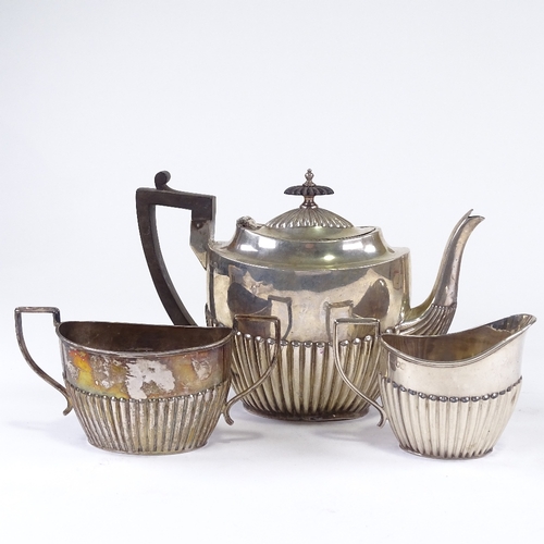 554 - A Victorian silver matched 3-piece teaset, oval half-fluted form with ebonised mounts, comprising 1x... 