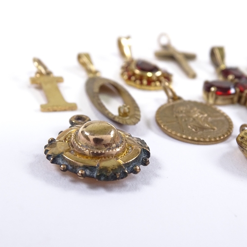 563 - Various 9ct gold pendants, including garnet cruciform example, modernist diamond set example etc, 13... 