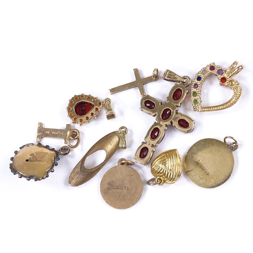 563 - Various 9ct gold pendants, including garnet cruciform example, modernist diamond set example etc, 13... 