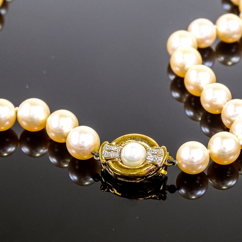 580 - A single strand freshwater pearl Princess necklace, with 9ct pearl and diamond set clasp, necklace l... 