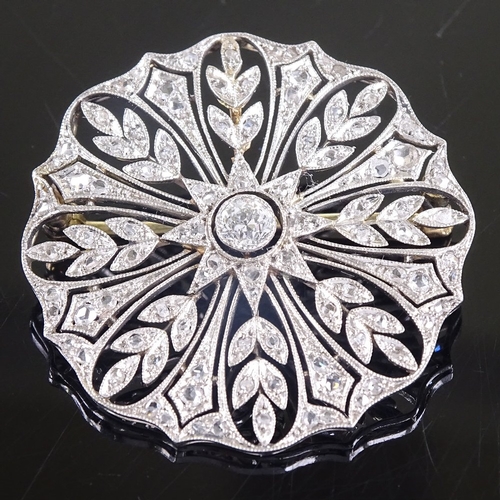 592 - A Belle Epoque unmarked platinum and diamond cluster floral brooch, pierced millegrain settings, set... 