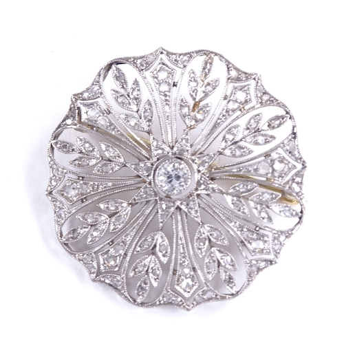 592 - A Belle Epoque unmarked platinum and diamond cluster floral brooch, pierced millegrain settings, set... 