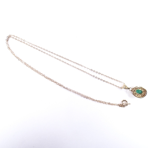 598 - A 9ct gold emerald and diamond cluster pendant necklace, on 9ct trace link chain, pendant height exc... 