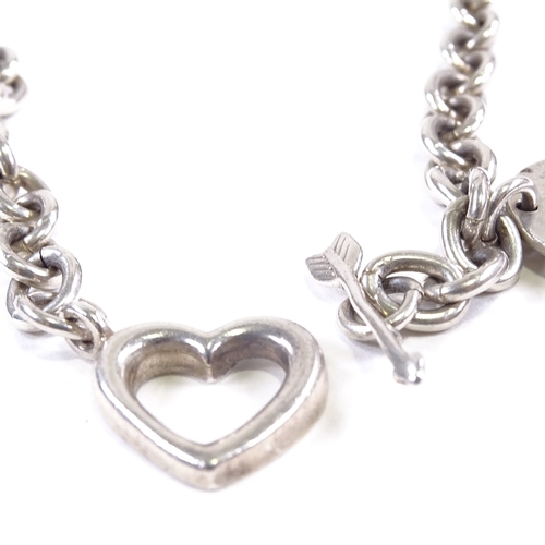 599 - TIFFANY & CO - a 1994 Italian sterling silver arrow and heart clasp chain necklace, with Return to T... 