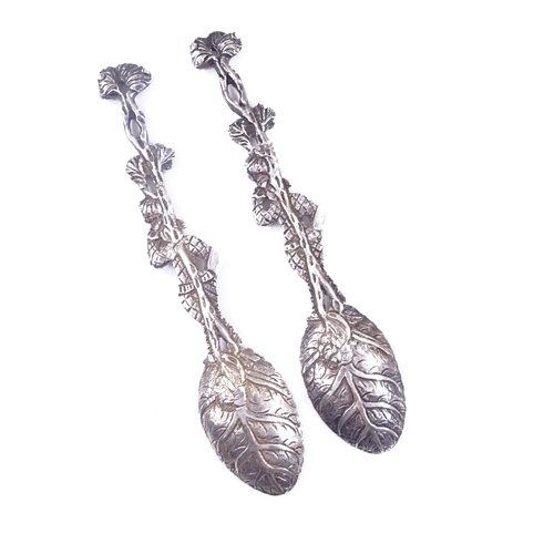 601 - A pair of George IV unmarked silver harlequin clown teaspoons, detailed engraved leaf bowls, length ... 