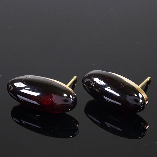 605 - A pair of unmarked gold cabochon garnet stud earrings, garnet length 18.1mm, 4.2g