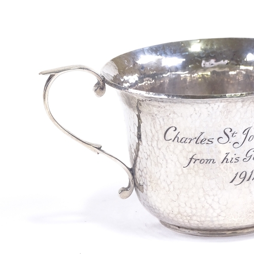 609 - A George V silver porringer, planished decoration with inscription to Charles St. John Pulley, by Go... 