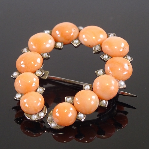 616 - A Victorian unmarked gold coral and split pearl horseshoe brooch, brooch height 34mm, 6.1g