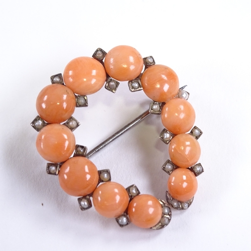 616 - A Victorian unmarked gold coral and split pearl horseshoe brooch, brooch height 34mm, 6.1g