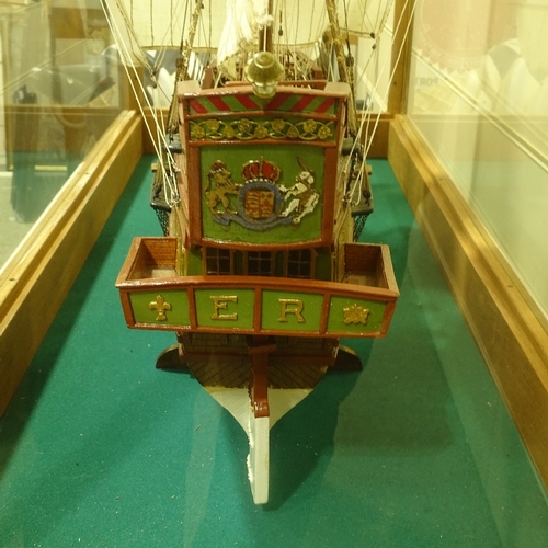 191 - A scratch-built wooden-hulled model of the Golden Hind, in large teak-framed display case, case leng... 