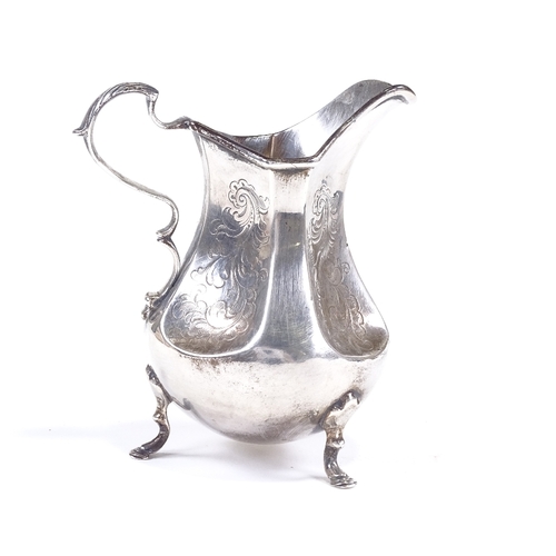 623 - A Victorian silver cream jug, bulbous form with foliate engraved dimpled panels and scrolled acanthu... 