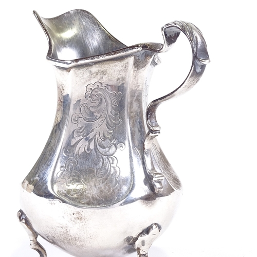 623 - A Victorian silver cream jug, bulbous form with foliate engraved dimpled panels and scrolled acanthu... 