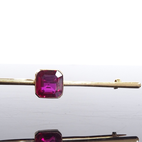 626 - An 18ct gold red stone bar brooch, brooch length 64.3mm, 4.8g