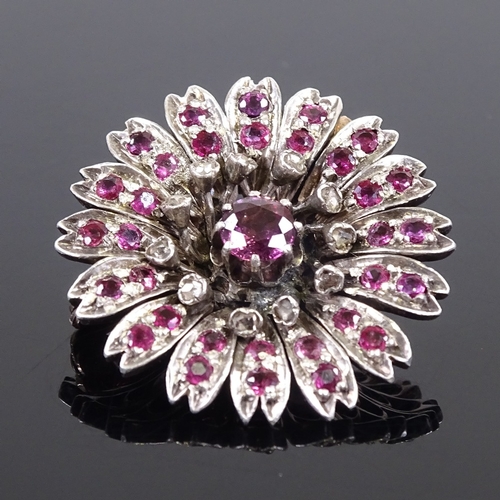 629 - A Victorian unmarked gold ruby and diamond cluster flowerhead brooch, brooch diameter 26.2mm, 8.7g