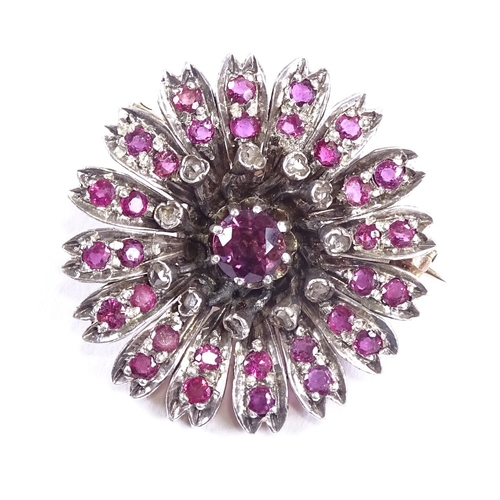 629 - A Victorian unmarked gold ruby and diamond cluster flowerhead brooch, brooch diameter 26.2mm, 8.7g