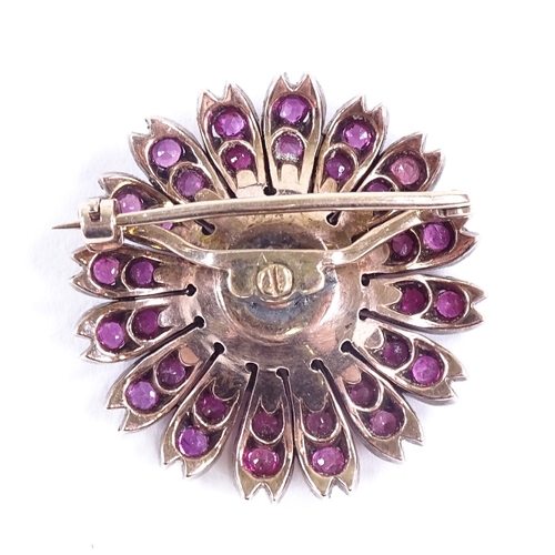 629 - A Victorian unmarked gold ruby and diamond cluster flowerhead brooch, brooch diameter 26.2mm, 8.7g