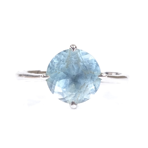 630 - A 14ct white gold blue topaz dress ring, hallmarks London 2014, maker's marks DH, setting height 10.... 