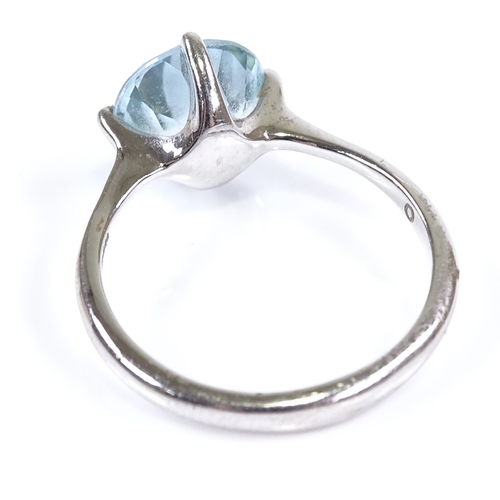 630 - A 14ct white gold blue topaz dress ring, hallmarks London 2014, maker's marks DH, setting height 10.... 