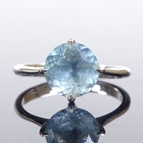 630 - A 14ct white gold blue topaz dress ring, hallmarks London 2014, maker's marks DH, setting height 10.... 