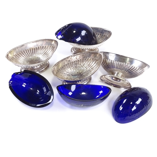 632 - A set of 4 late Victorian silver salt cellars, marquise half-fluted form with blue glass liners, by ... 