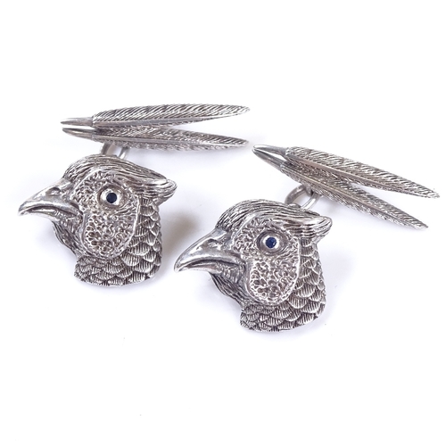 634 - A pair of 21st century sterling silver pheasant cufflinks, feather and head panels with sapphire set... 