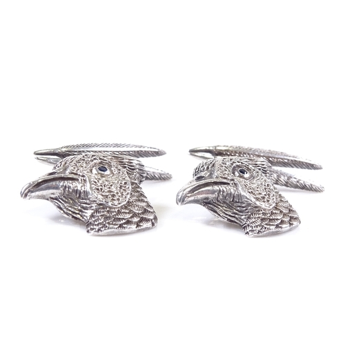 634 - A pair of 21st century sterling silver pheasant cufflinks, feather and head panels with sapphire set... 