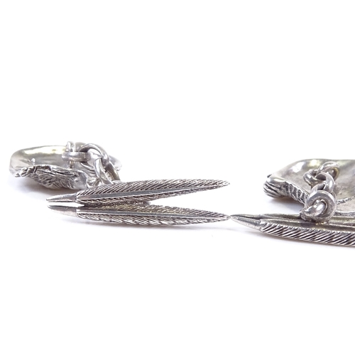 634 - A pair of 21st century sterling silver pheasant cufflinks, feather and head panels with sapphire set... 