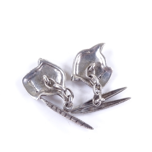 634 - A pair of 21st century sterling silver pheasant cufflinks, feather and head panels with sapphire set... 