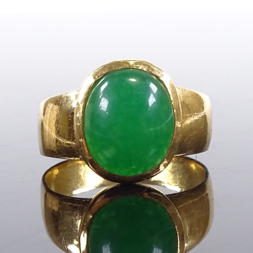 638 - A large Chinese unmarked gold cabochon green quartz ring, setting height 15.6mm, size V/W, 10.5g