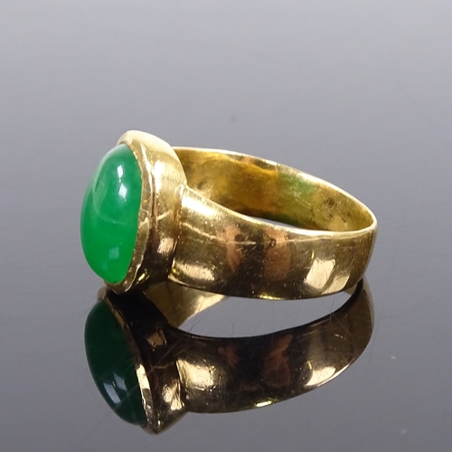 638 - A large Chinese unmarked gold cabochon green quartz ring, setting height 15.6mm, size V/W, 10.5g