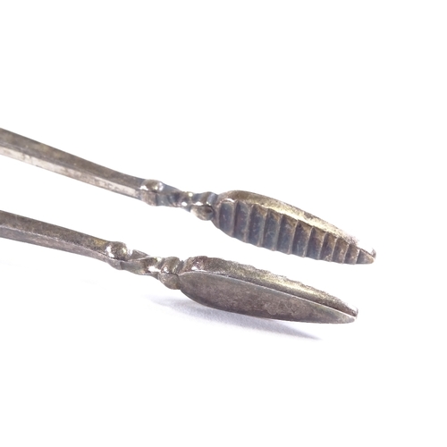 645 - GEORG JENSEN - a pair of Danish sterling silver Kugel pattern sugar tongs, beaded edge with sprung c... 