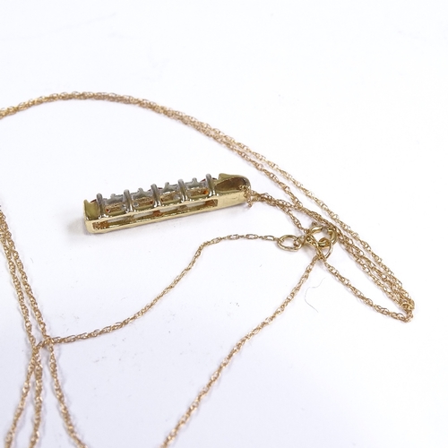 647 - A late 20th century unmarked gold CZ and orange stone line pendant necklace, on 9ct trace link chain... 