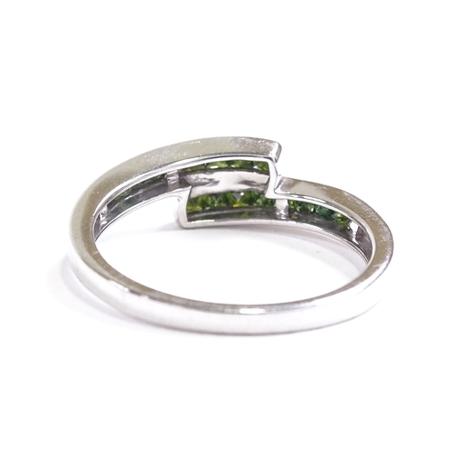 654 - A 9ct white gold Russian diopside crossover dress ring, setting height 5.8mm, size P, 2.5g