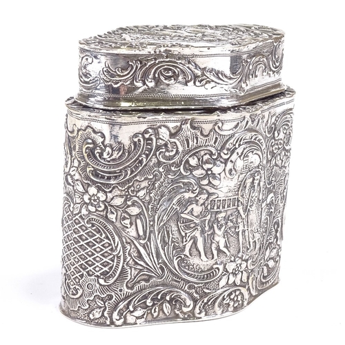 658 - A Continental silver tea caddy of shaped oval form with relief embossed lovers scenes, Swedish contr... 