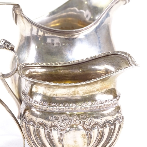 703 - A small Victorian silver cream jug, hallmarks Birmingham 1895, and an Art Deco helmet-shaped cream j... 