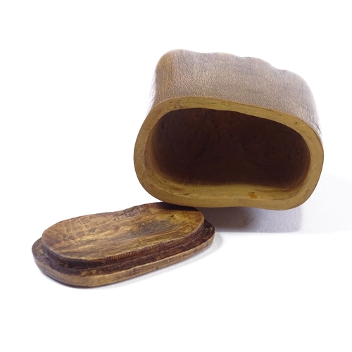 103 - A 19th century carved treen hand-design snuffbox, length 9cm