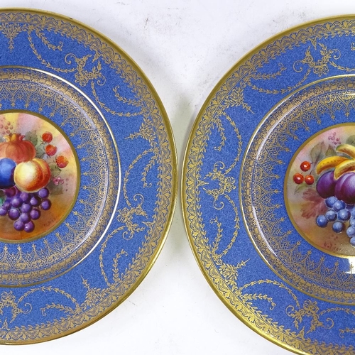 162 - George Jones Present China, a pair of blue ground gilded cabinet plates with hand painted fruit pane... 